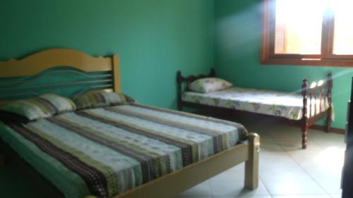 Postel nebo postele na pokoji v ubytování Residencial Campo Dunna