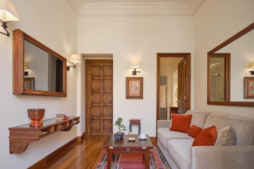 a living room with a couch and a table at Airelles Pan Dei Palais in Saint-Tropez