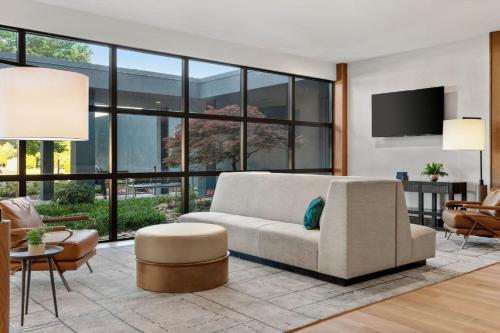 a living room with a couch and a tv at Delta Hotels by Marriott Bristol in Bristol