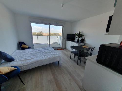 Posteľ alebo postele v izbe v ubytovaní appartement remblai saint hilaire de riez