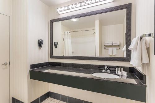 a bathroom with a sink and a mirror at Fairfield Inn and Suites by Marriott Madison East in Madison