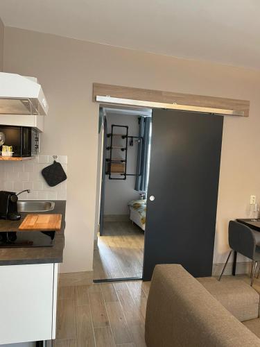 a kitchen with a door leading into a room at Excellent house in Ediger-Eller