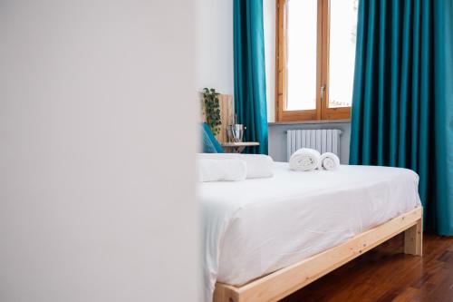 Postel nebo postele na pokoji v ubytování Il corso suite rooms