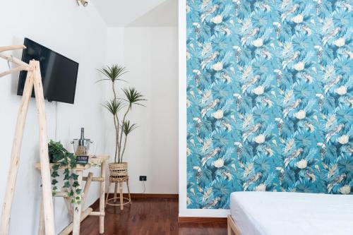 Postel nebo postele na pokoji v ubytování Il corso suite rooms