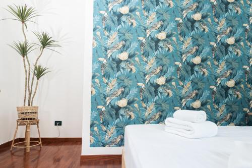 Postel nebo postele na pokoji v ubytování Il corso suite rooms