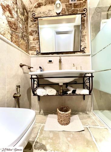 a bathroom with a sink and a mirror at L’Antica Dimora in Bari