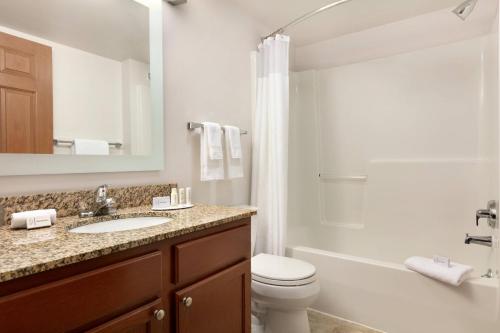 a bathroom with a sink and a toilet and a shower at TownePlace Suites Gaithersburg in Gaithersburg