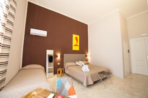 Posezení v ubytování GreRos H. Rooms Napoli Centro by Clapa Group Dislocated Hospitality