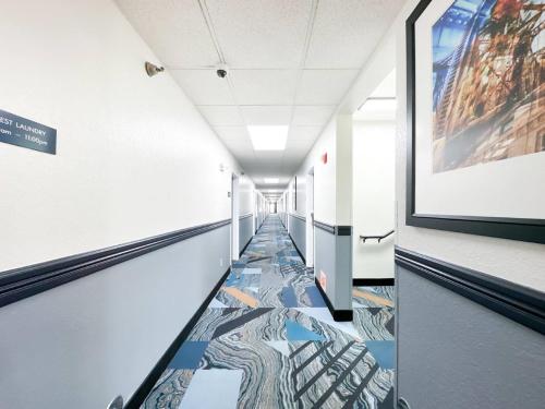 a hallway with a colorful floor in a building at Blaine Town Inn & Suites in Blaine