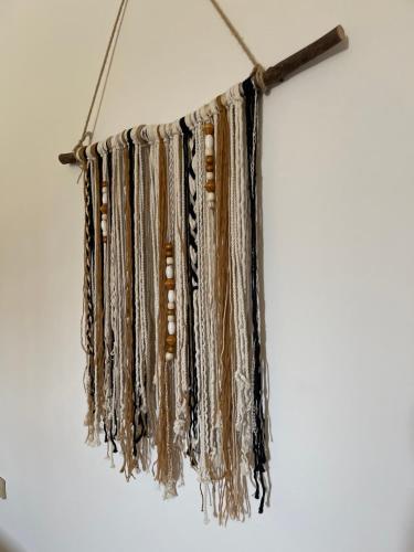 a bunch ofaments hanging on a wall at La Casa Guest House in Marsa Alam City