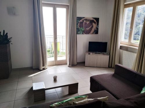 a living room with a couch and a coffee table at Casa Bine in Tremosine Sul Garda