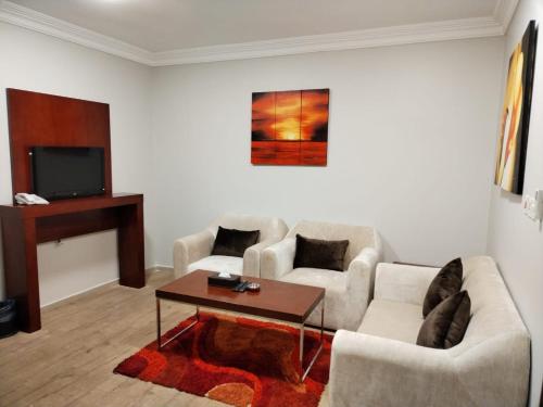 Televisyen dan/atau pusat hiburan di نزل تالا للشقق المخدومة - Tala nezel Serviced Apartments