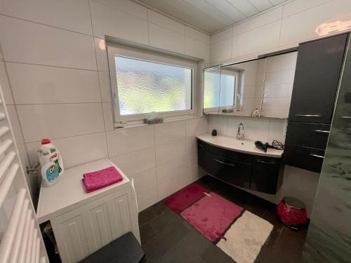 a bathroom with a sink and a mirror at Ferienwohnung Unterlerchner in Afritz
