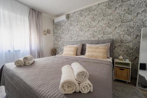 Postel nebo postele na pokoji v ubytování Silver Room
