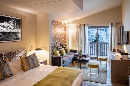 Postel nebo postele na pokoji v ubytování Hotel Hermitage Relais & Châteaux