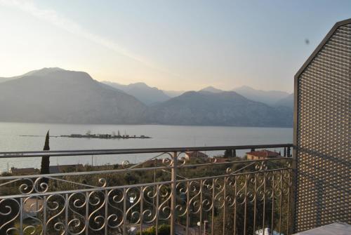 a balcony with a view of a body of water at Hotel Casa Gagliardi in Brenzone sul Garda