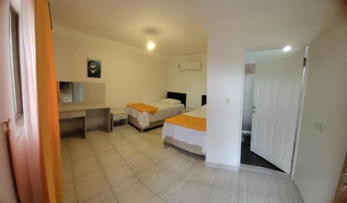 Postel nebo postele na pokoji v ubytování Apsa Butik Hotel