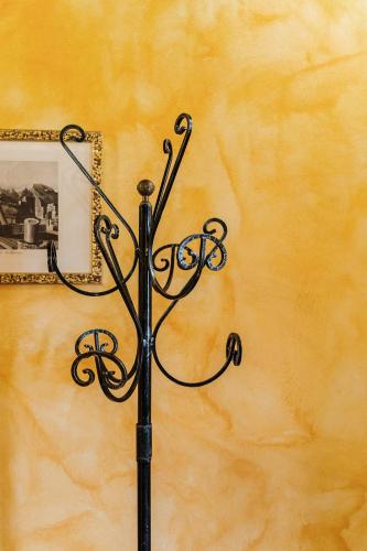 a black metal object in front of a mirror at Villa Nottola in Montepulciano