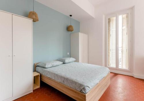 Posteľ alebo postele v izbe v ubytovaní Charmantes chambres privées dans appartement en hypercentre - Marseille Longchamp