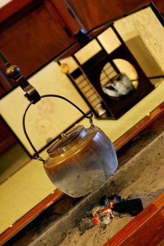 a metal bowl hanging from a wire on a table at Sakan in Sendai
