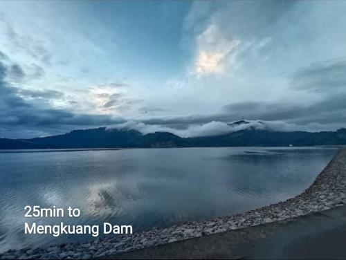 a large body of water with a cloudy sky at I Do Farmstay in Bukit Mertajam