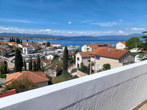 a view of a city from a balcony at Guesthouse Cecilia 2 in Malinska
