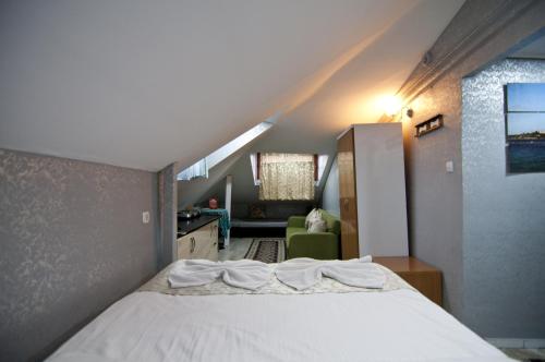 a bedroom with a large bed in a attic at The New Season Apart in Istanbul
