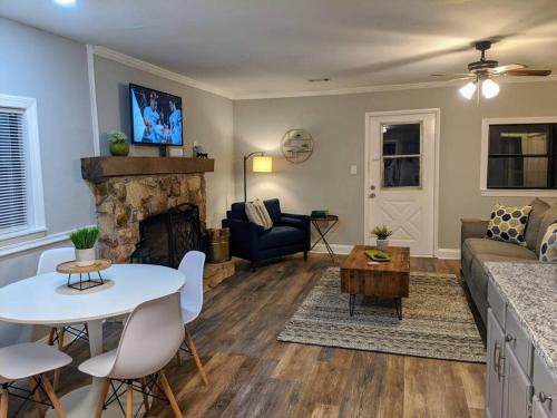 a living room with a couch and a table at Gold Dust Delight - Cozy Cottage In The Woods in Dahlonega