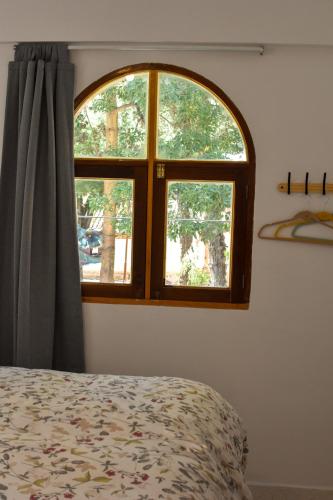 Ένα ή περισσότερα κρεβάτια σε δωμάτιο στο Hostal Margaritas - Torotoro