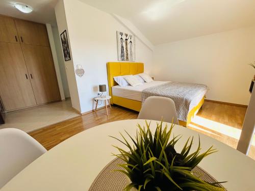 Ένα ή περισσότερα κρεβάτια σε δωμάτιο στο Apartments Angelo