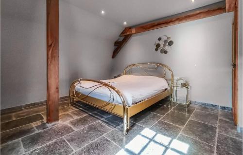 a bedroom with a metal bed in a room at Nice Home In Damme With Wifi in Damme