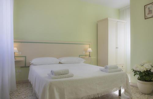 En eller flere senge i et værelse på Il Linchetto