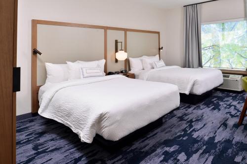 a hotel room with two beds and a window at Fairfield Inn and Suites by Marriott Minneapolis Shakopee in Shakopee