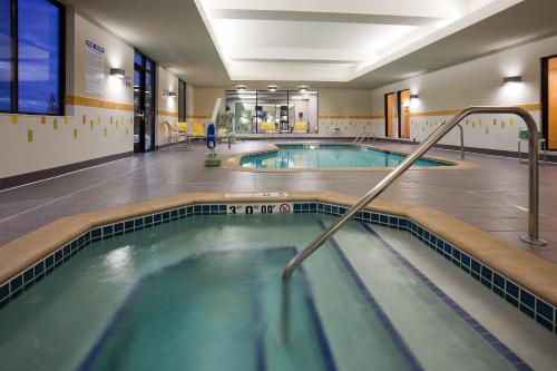 a swimming pool in a gym with two pools at Fairfield Inn & Suites by Marriott St. Paul Northeast in Vadnais Heights