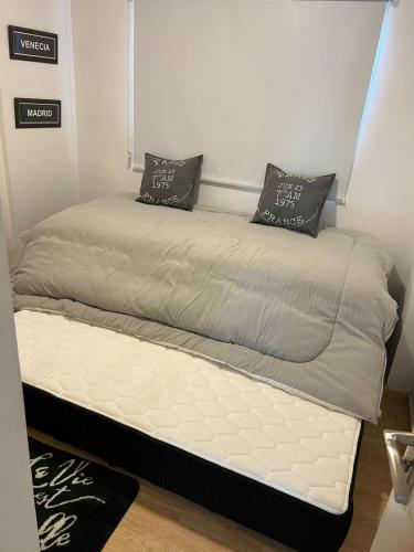 two beds sitting next to each other in a room at PALERMO APART in Buenos Aires