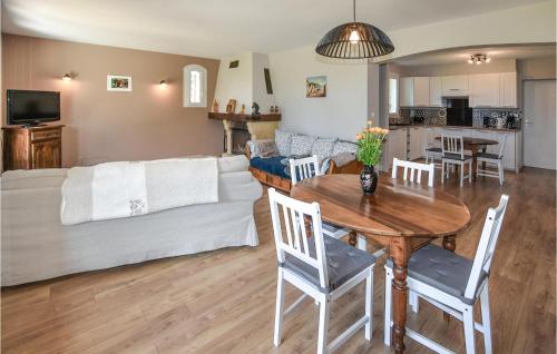a living room with a table and a couch at Nice Home In Rognonas With Wifi in Rognonas