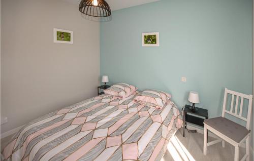 a bedroom with a bed and a chair at Nice Home In Rognonas With Wifi in Rognonas
