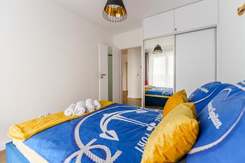 Posteľ alebo postele v izbe v ubytovaní Apartament Słońce i Plaża Kołobrzeg