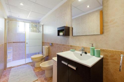 a bathroom with a sink and a toilet and a shower at CB Living - Scenic duplex with pool in Punta Prima in Orihuela Costa