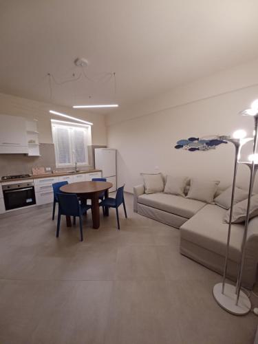 a living room with a couch and a table at Casa Lerici Holidays in Lerici