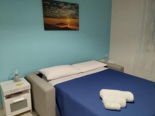 Ένα ή περισσότερα κρεβάτια σε δωμάτιο στο La Coccinella Sorrento