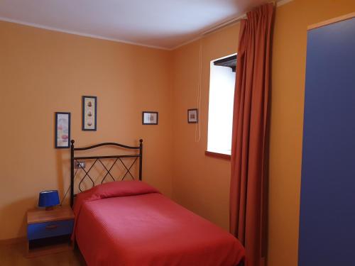 Cama o camas de una habitación en Appartamenti Vacanze e Camere Roccetta Fiorita