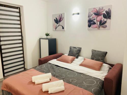 En eller flere senge i et værelse på Apartman Stipančić