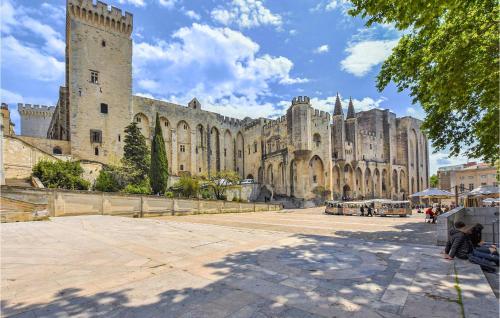 a large stone building with a large castle at Stunning Home In Vedène With Wifi in Vedène