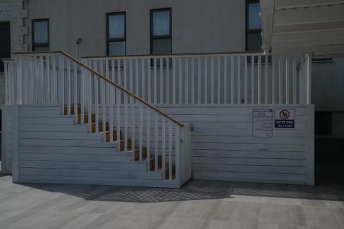 a set of stairs in a building with a sign at Puy Castele Hotel Tiberias in Tiberias