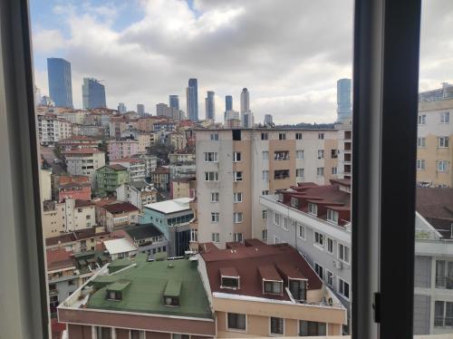 a view from a window of a city with buildings at Stay N play in Istanbul