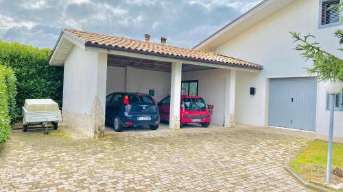 two cars parked in the garage of a house at Green Paradise in Sulmona
