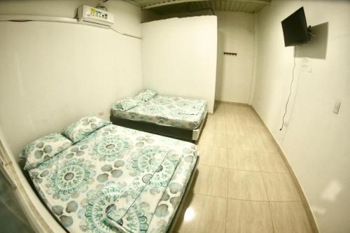 Tempat tidur dalam kamar di BAHIA MALECON