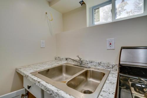 a kitchen with a sink and a counter top at Toms River Apartment about 5 Mi to Jersey Shore! in Toms River