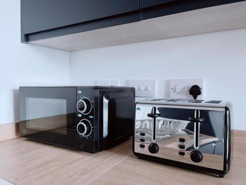 マンチェスターにあるModern Houseの電子レンジ、トースターオーブンが備わります。